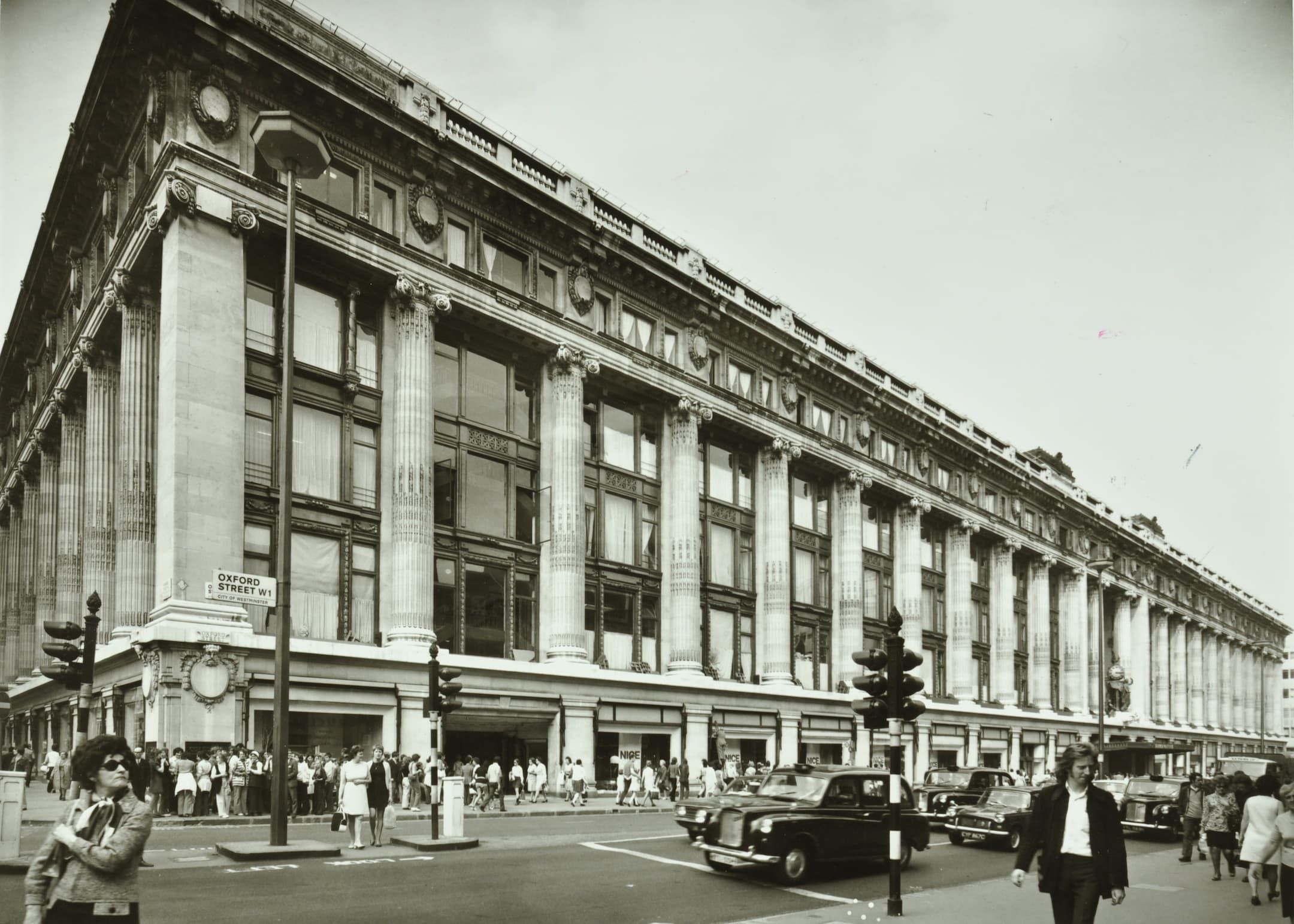 Exterior of Selfridges department store in Oxford Street in 1971. Queues of people outside.