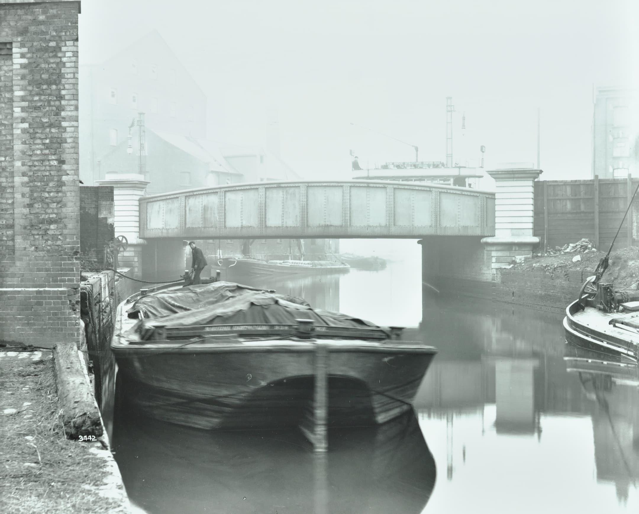 a bridge and a boat on the water