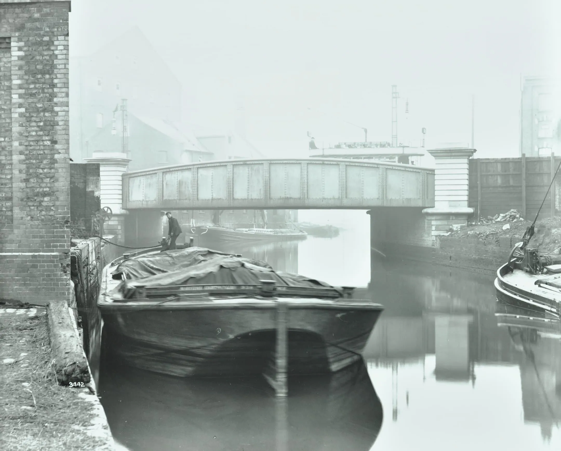 a bridge and a boat on the water