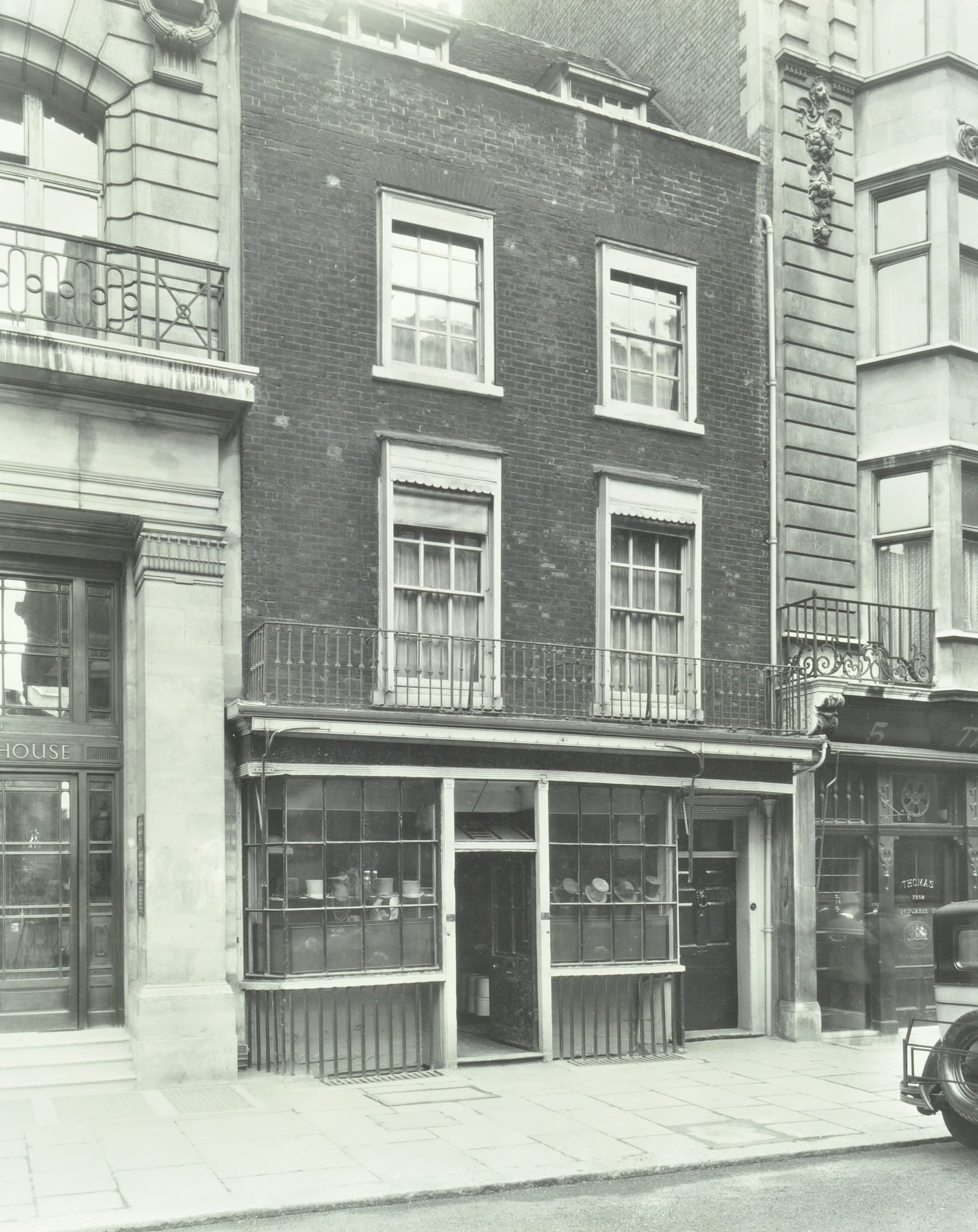 old shop front with hats in the window