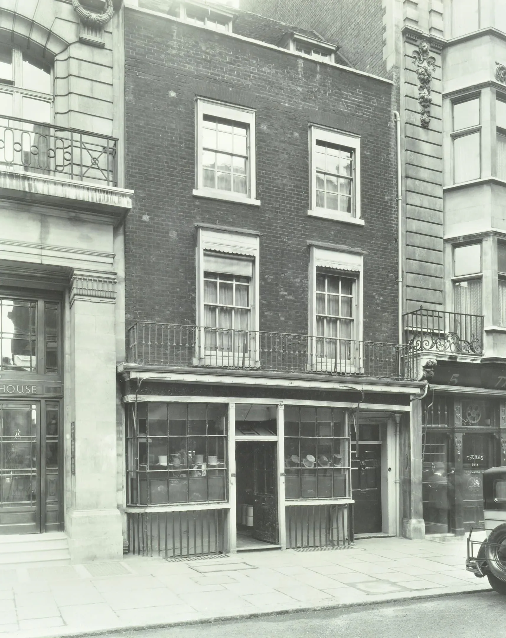 old shop front with hats in the window