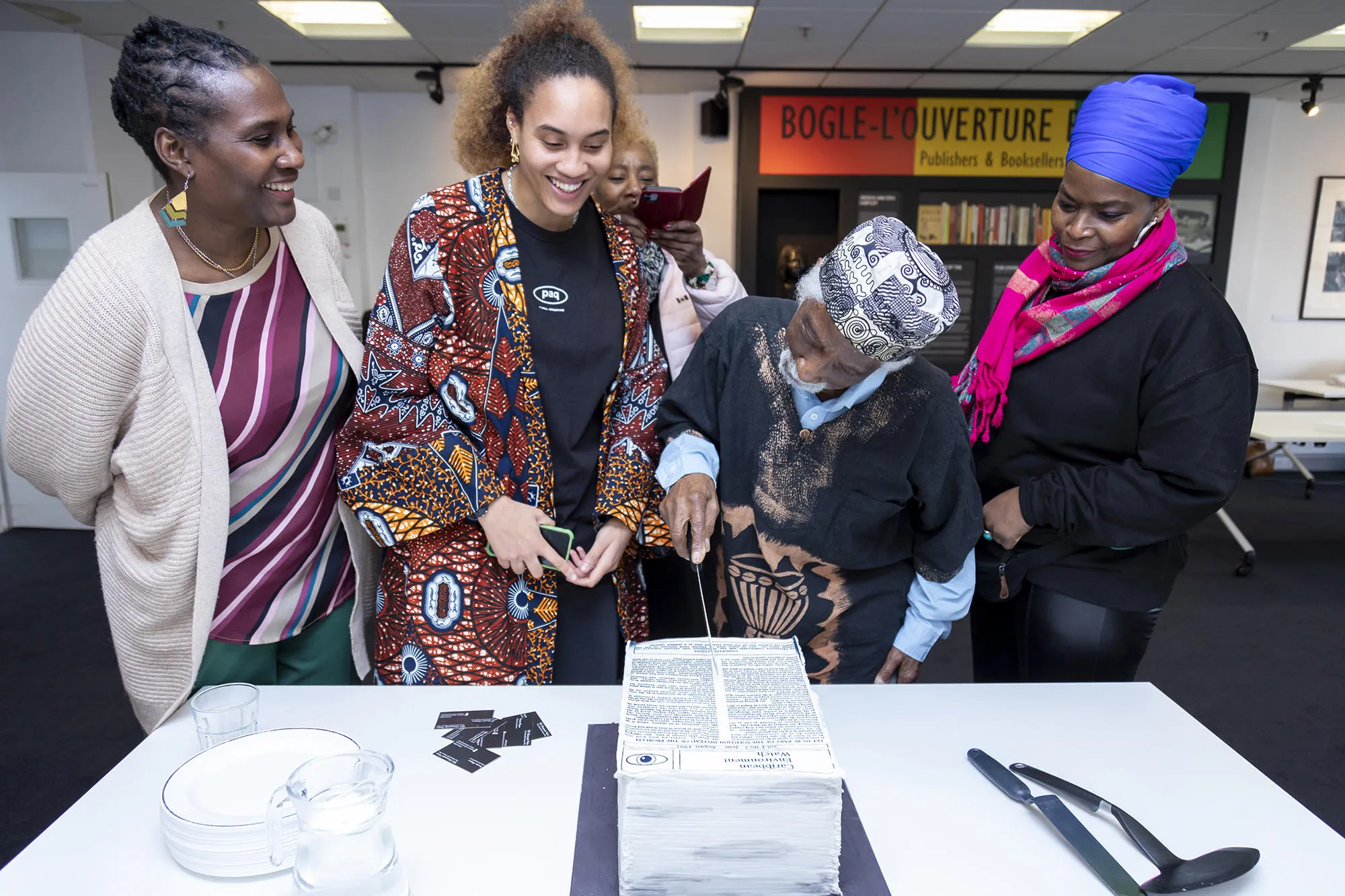 People cutting a cake at the Huntley Archives Conference in 2023
