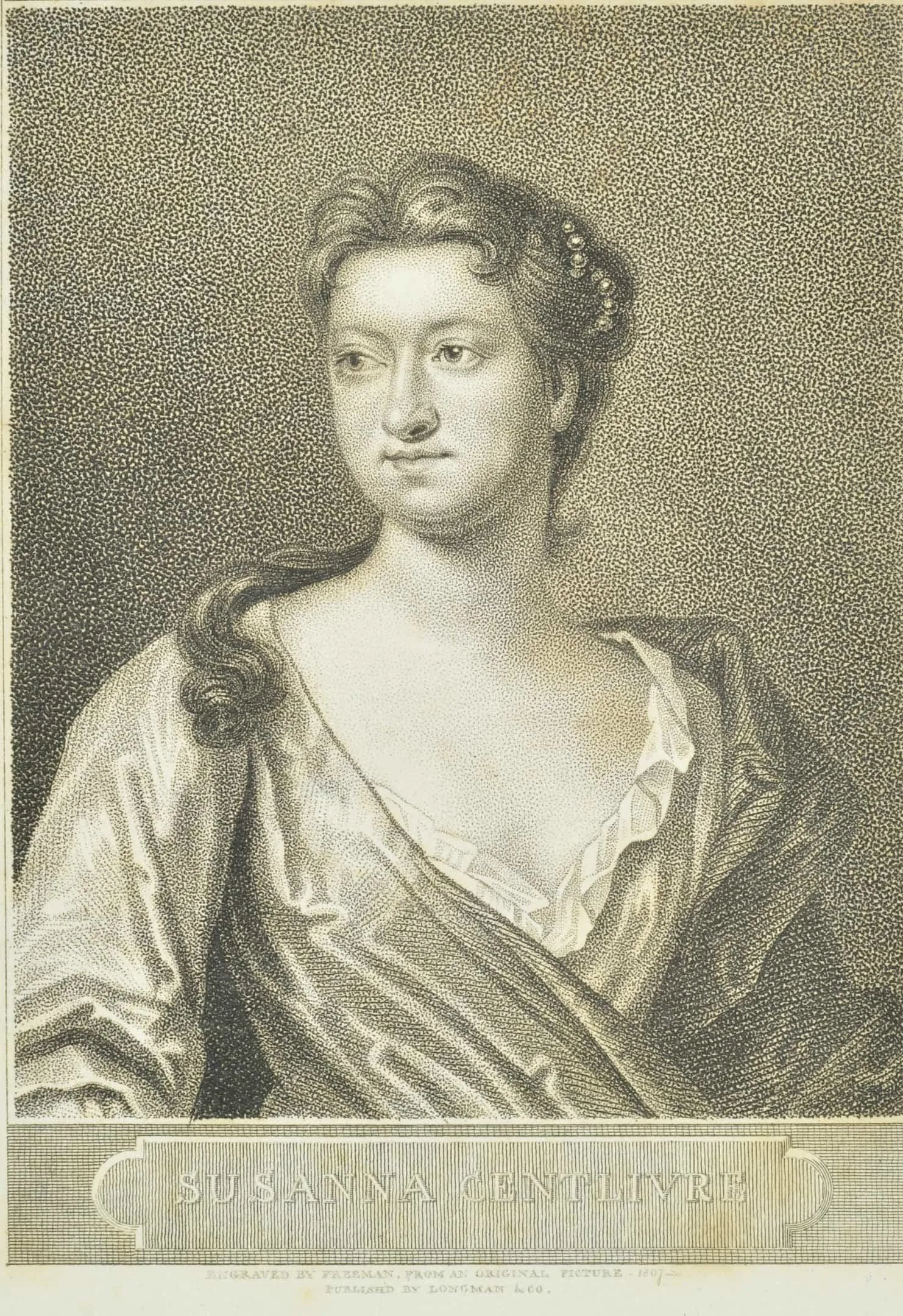 a woman with long hair pulled back and low gown