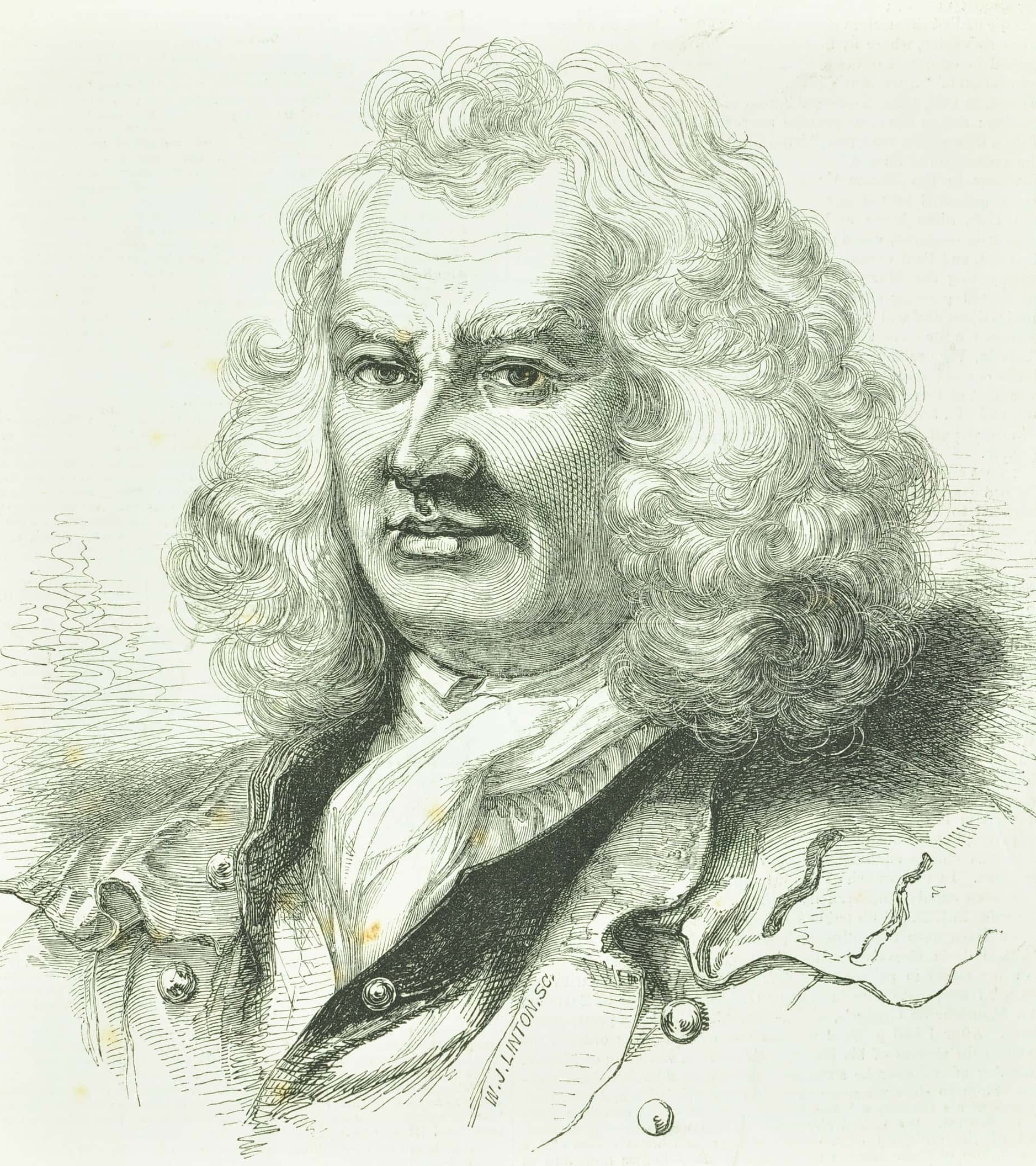 a man with a full head of curls and bushy eyebrows with a neck scarf