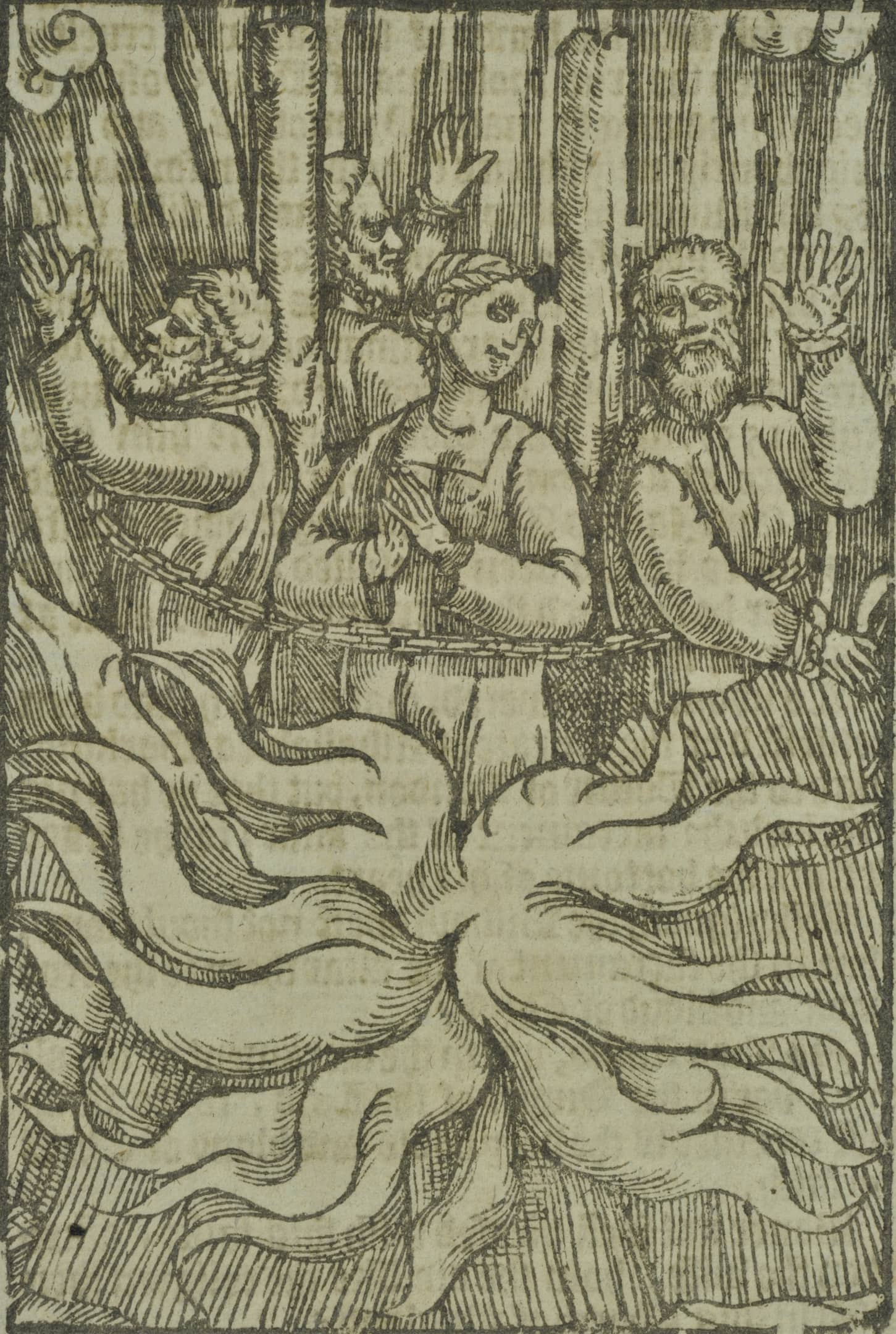 people chained in a circle with flames lapping at their bodies