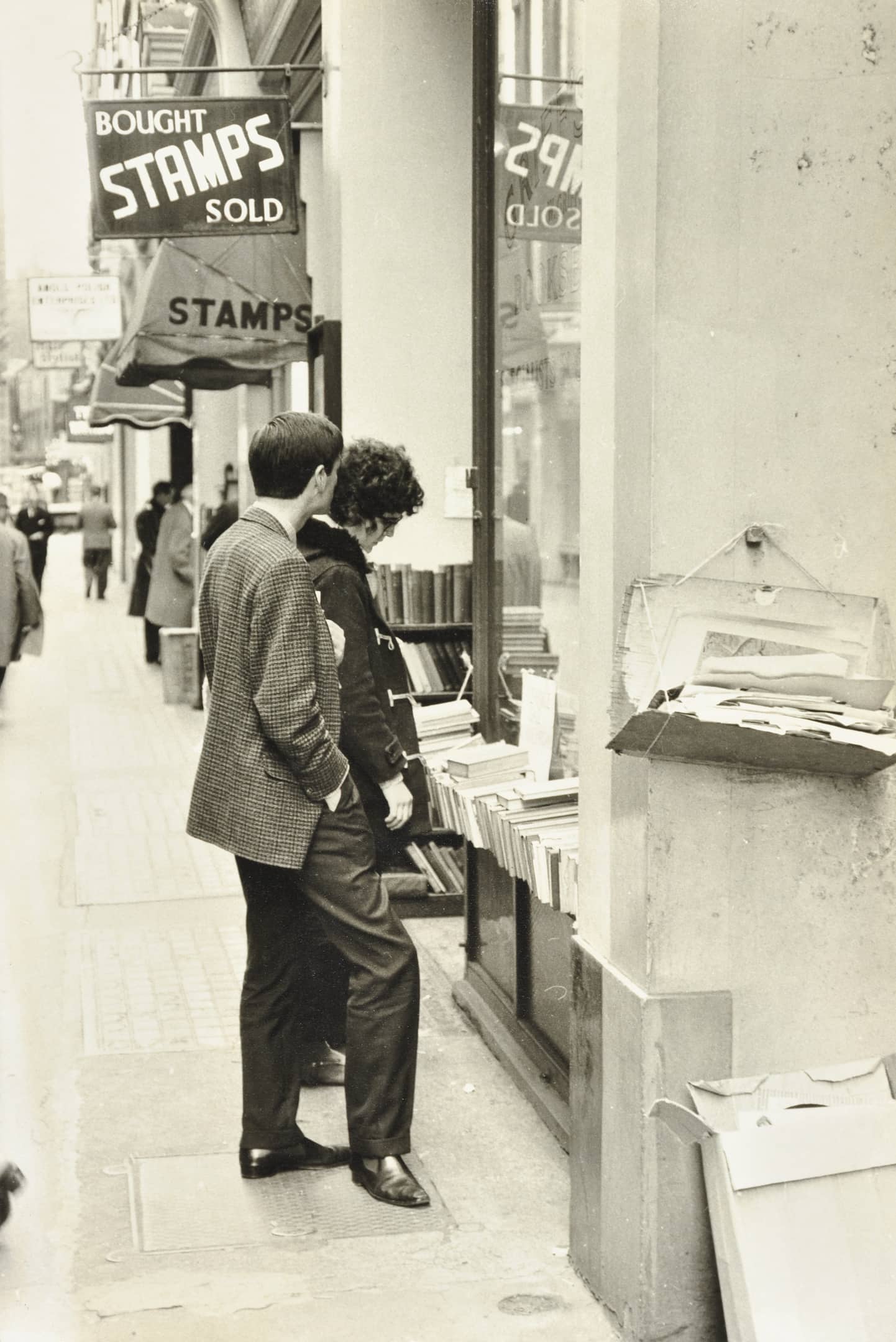 people look at books outside a shop