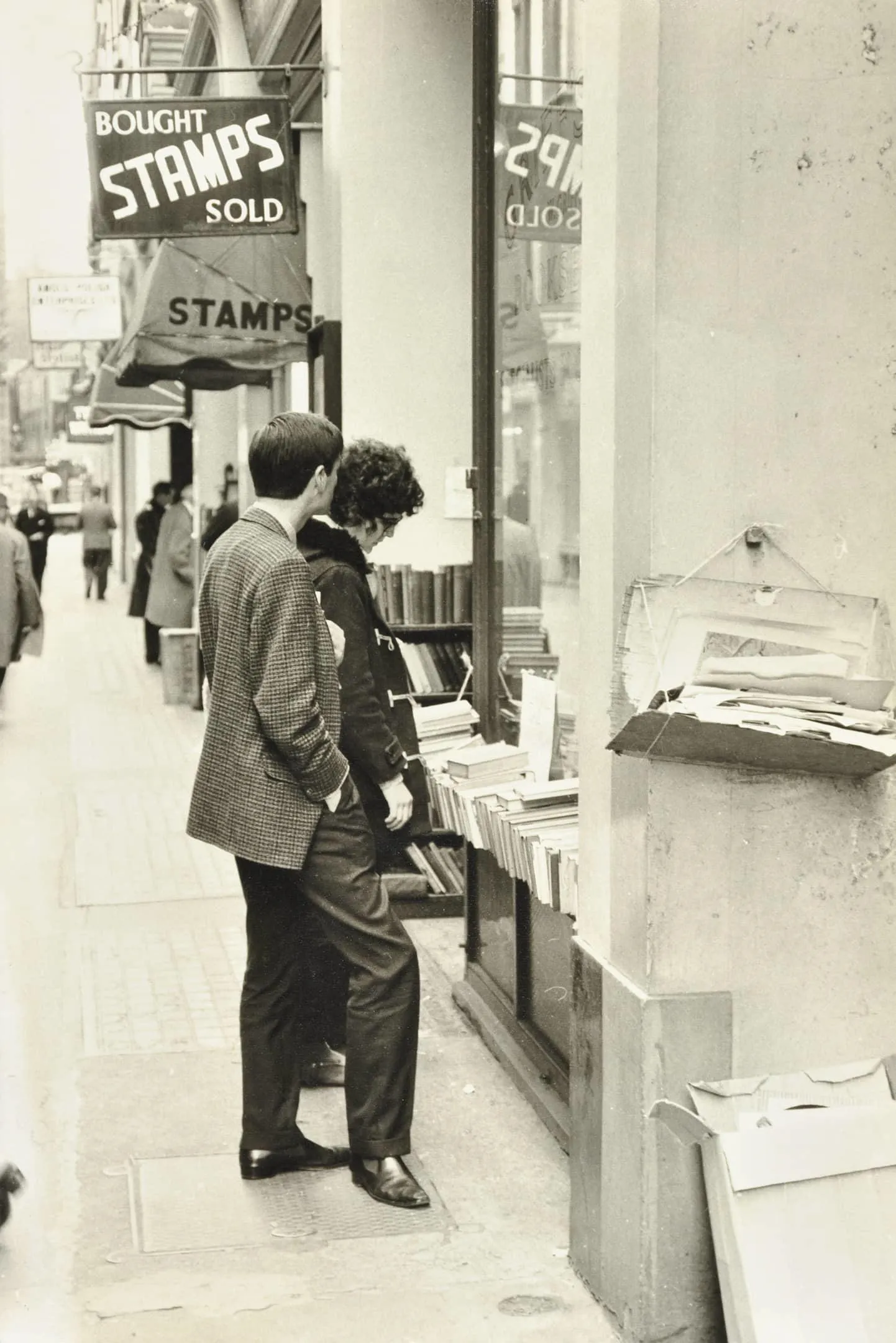 people look at books outside a shop