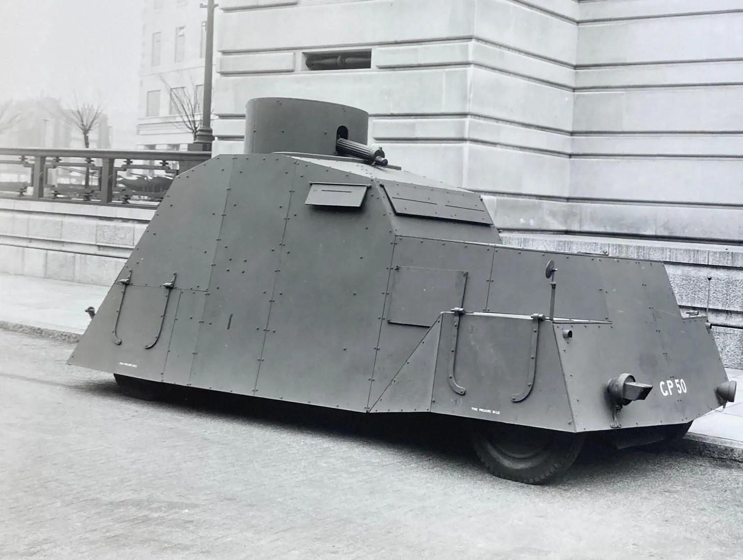 side view of an armoured car with one wheel visible