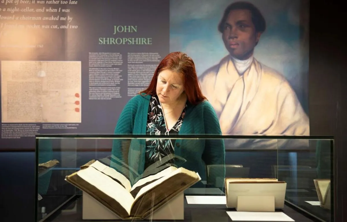 woman-viewing-unforgotten-lives-exhibition-1280