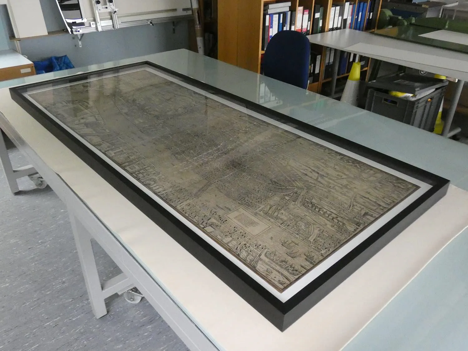 Map after conservation treatment mounted on backing board and set in a new frame