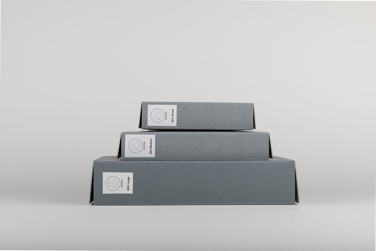 Different sized Clamshell boxes stacked on top of one another
