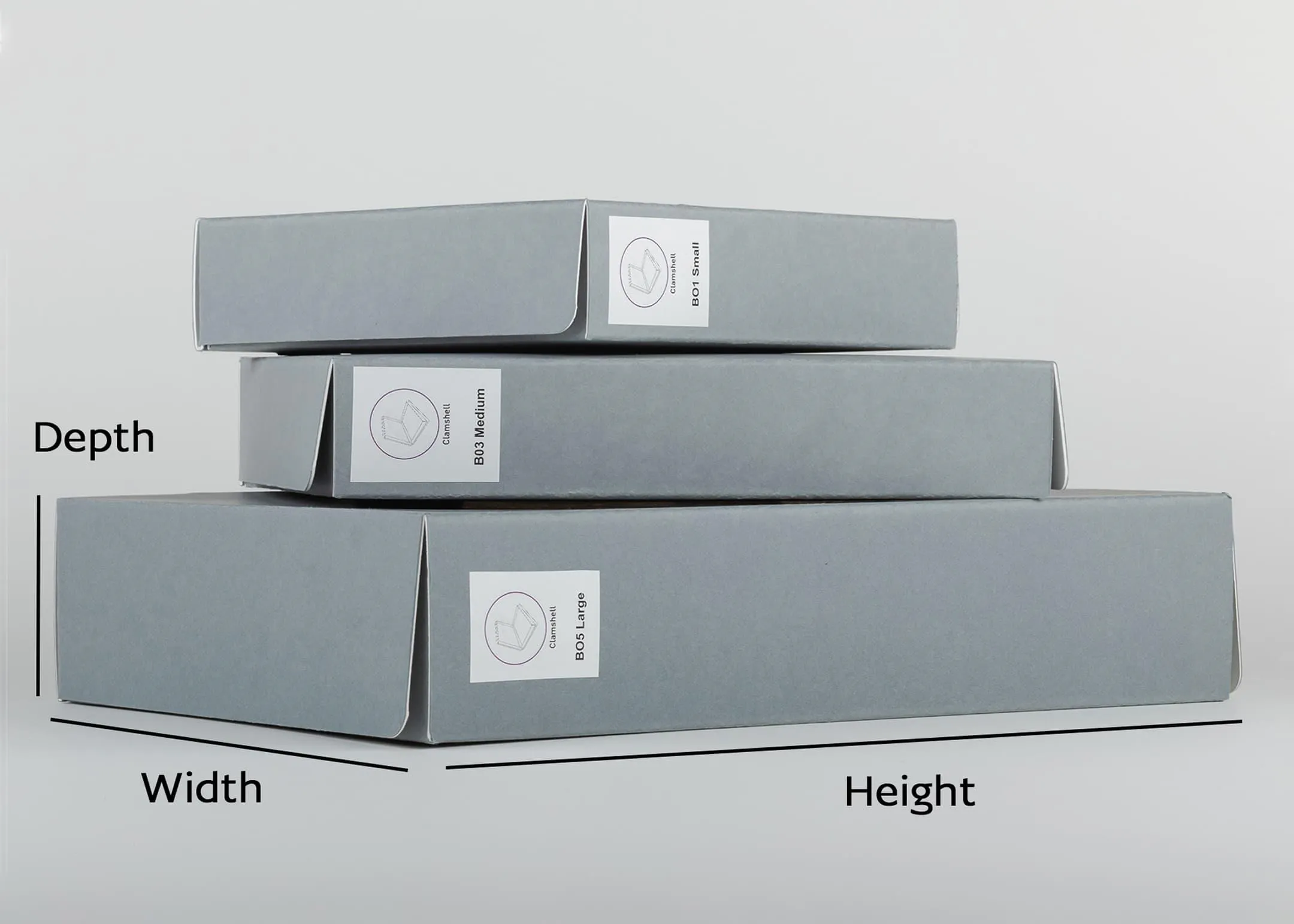 Clamshell boxes marked with the dimensions for height, width and depth
