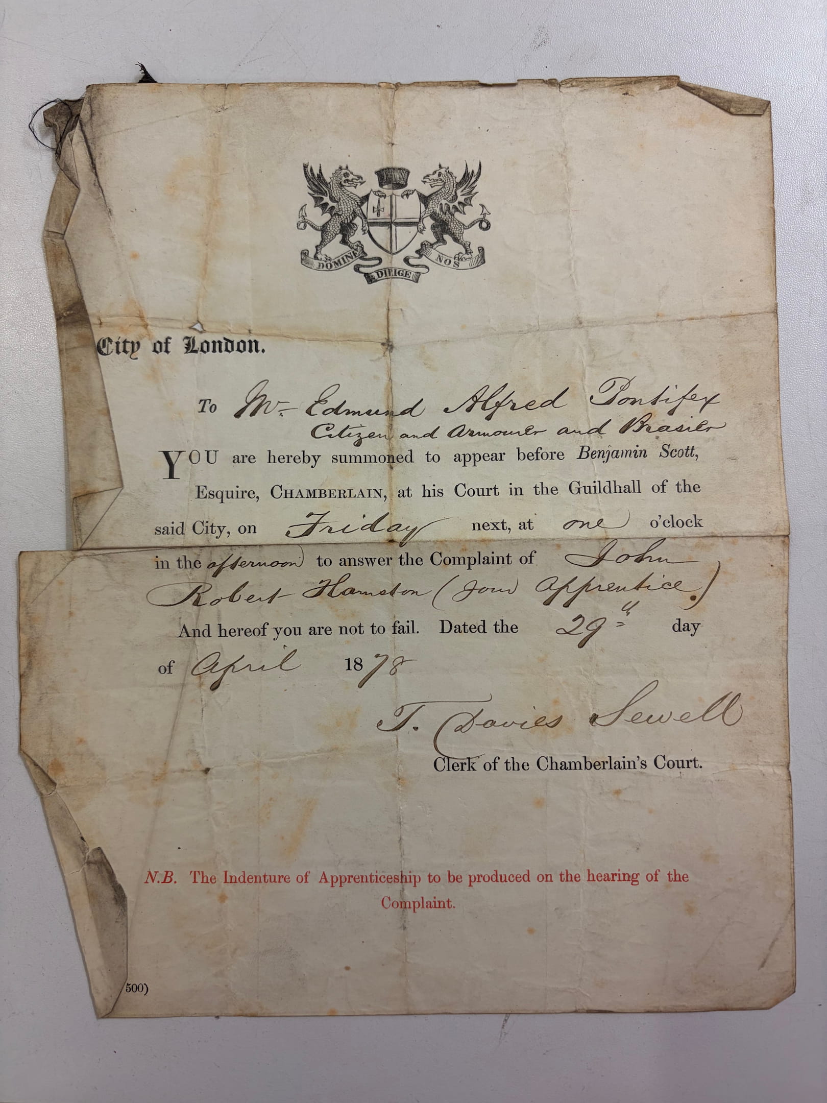 hand written summons amongst a printed template