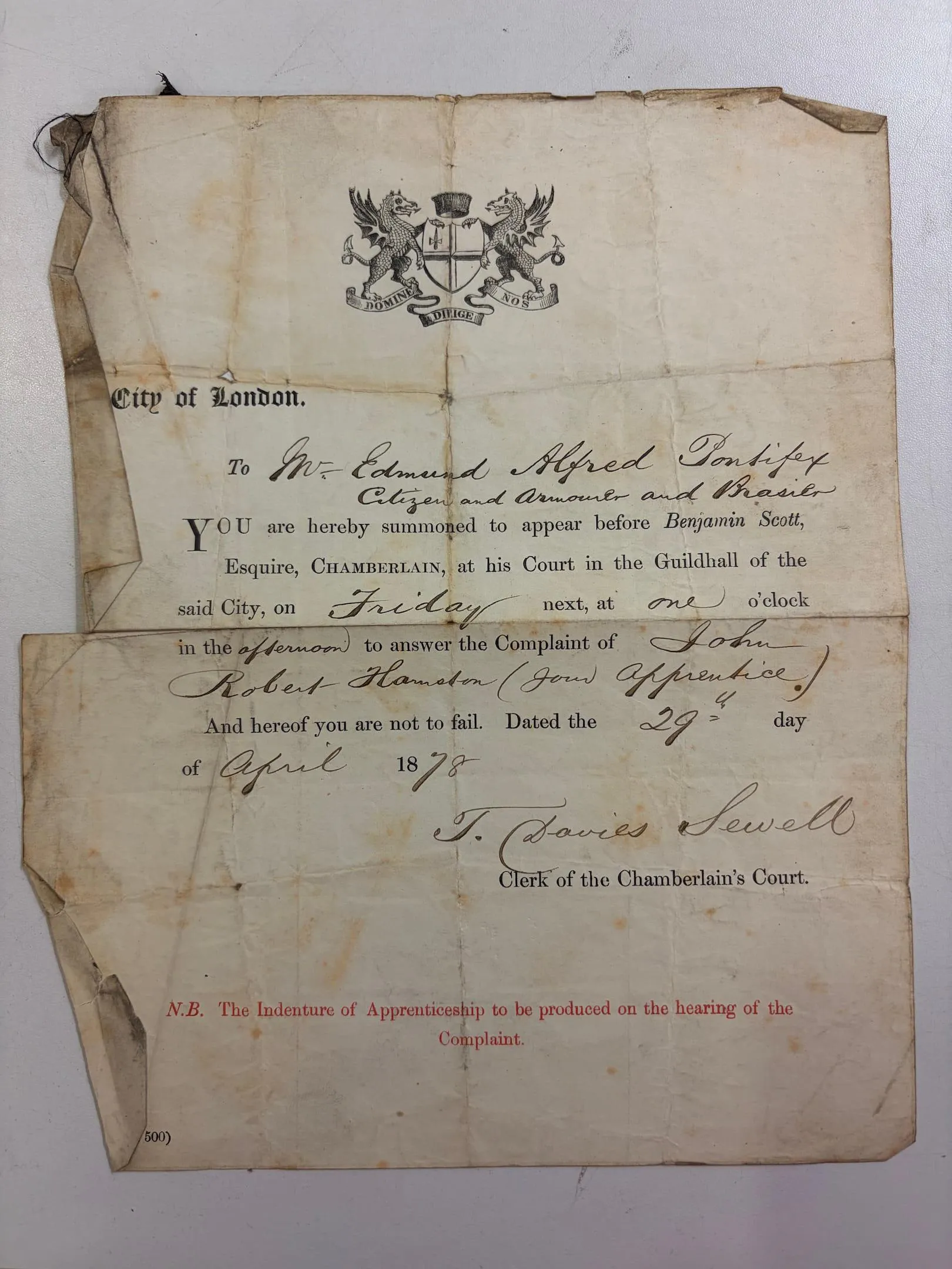 hand written summons amongst a printed template