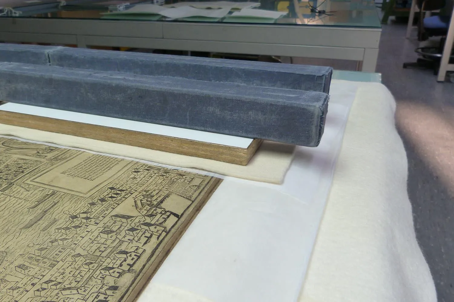 Map under weights used to flatten part of the document after conservation work