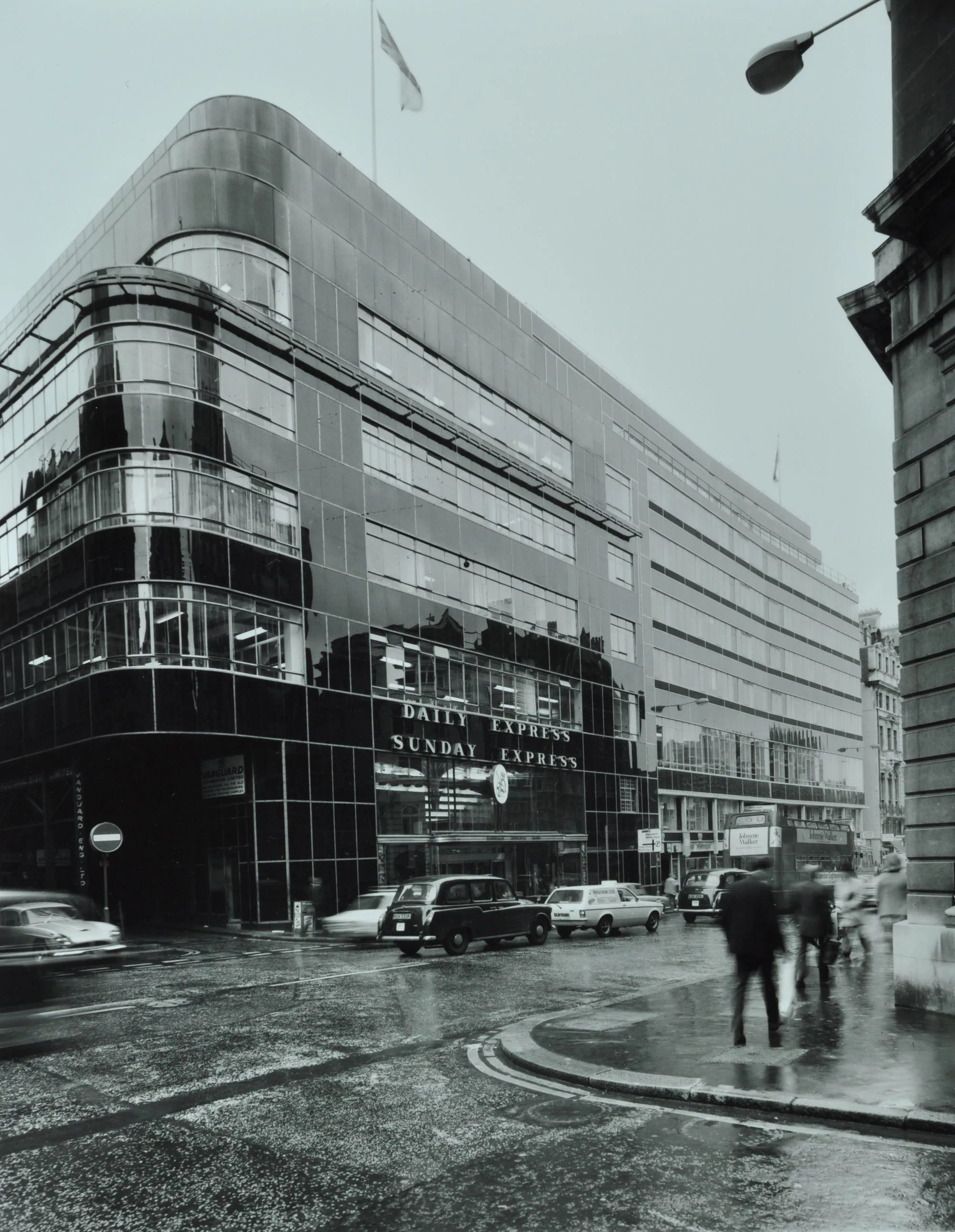 a black glass building with curved corners