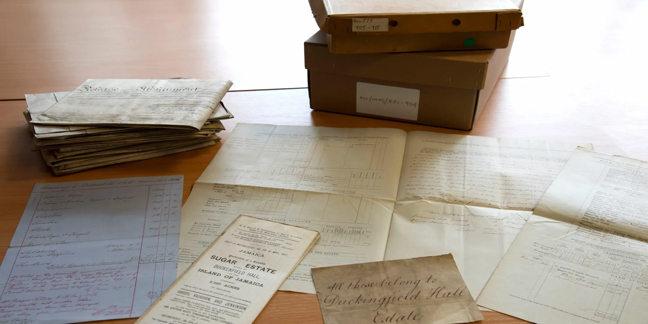 documents and a box laid out on a table