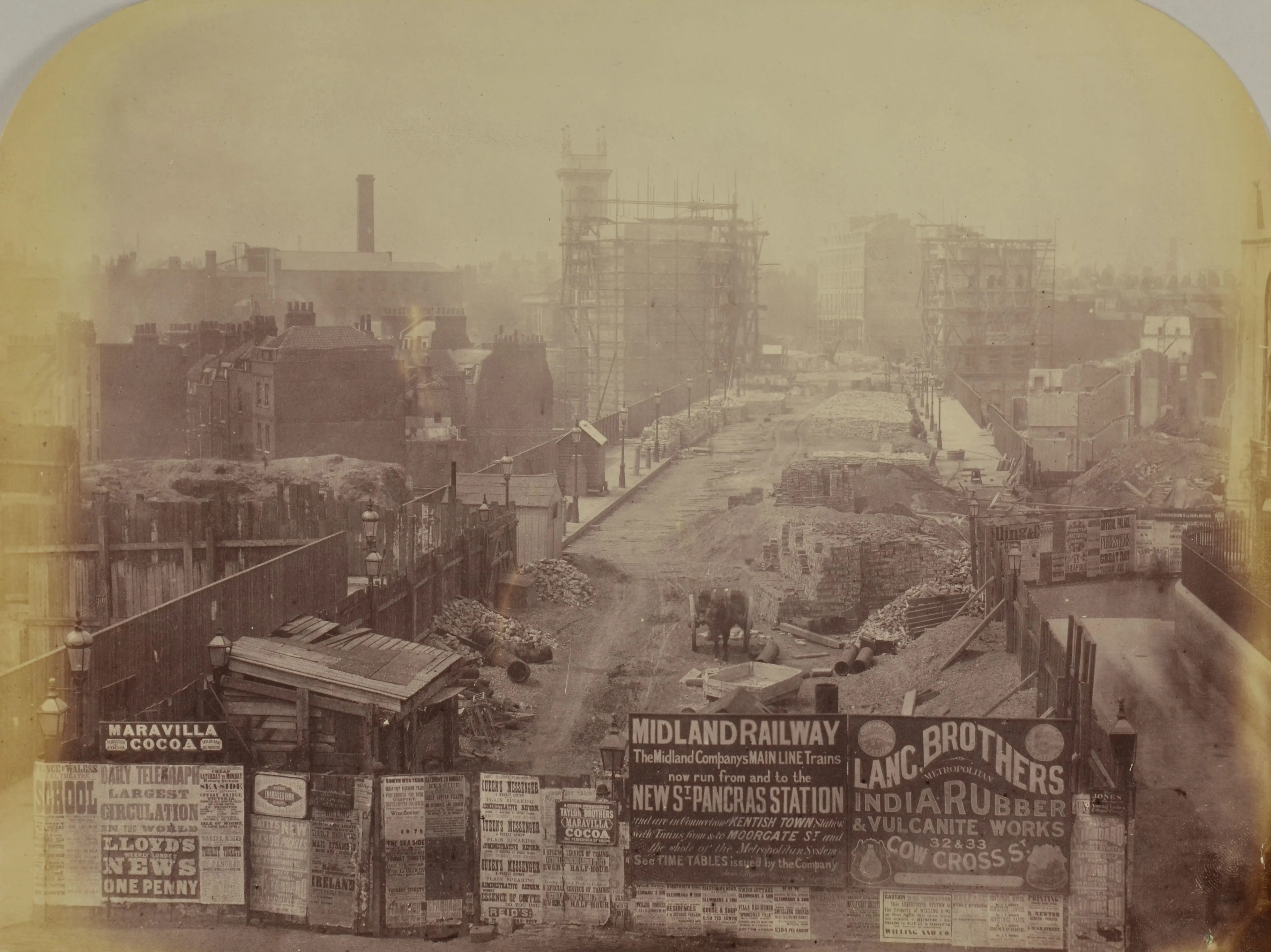 Holborn viaduct under construction with adverts for Midland Railway and India Rubber