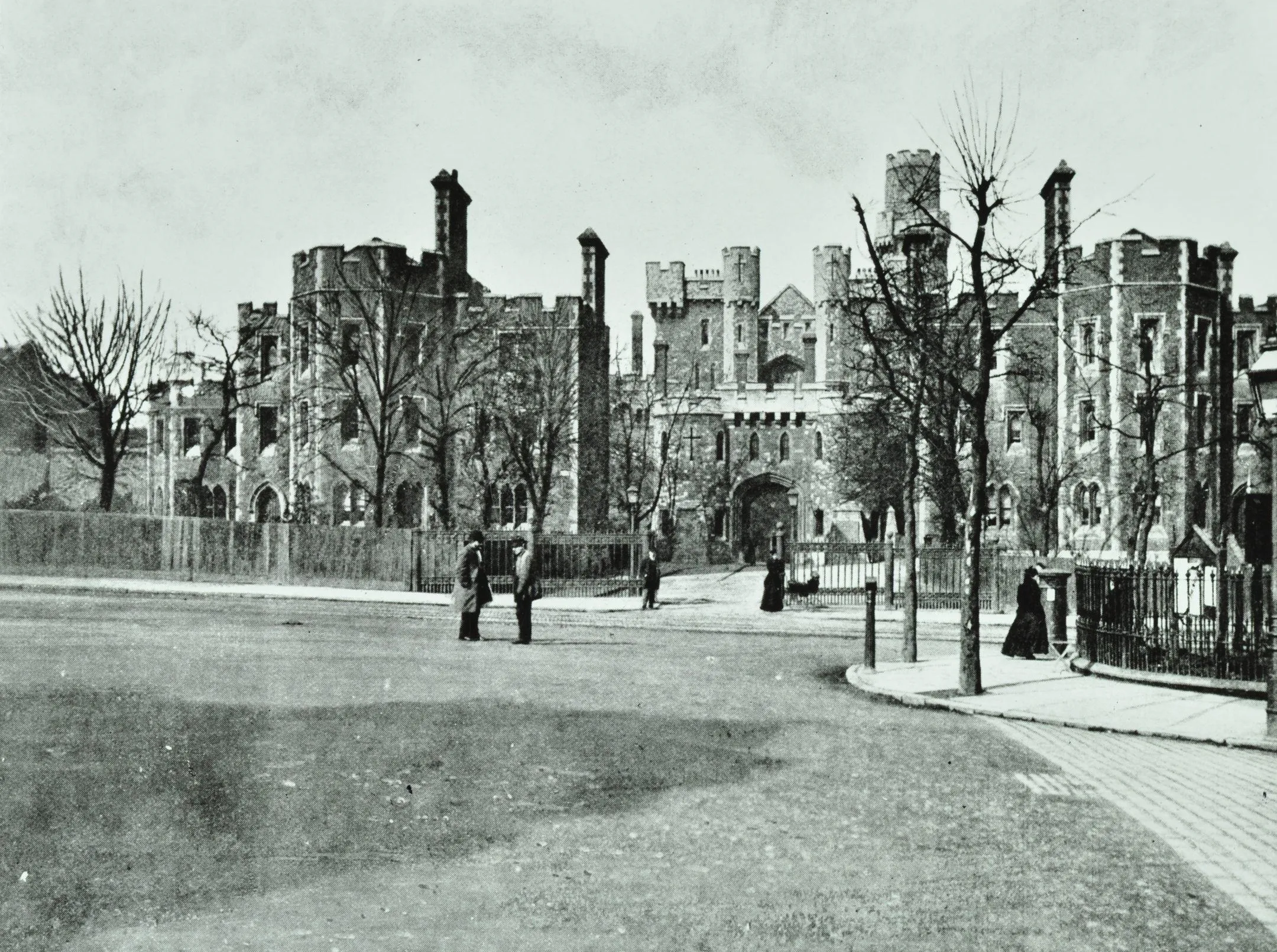 A picture of Holloway Prison from 1895 with people stood outside