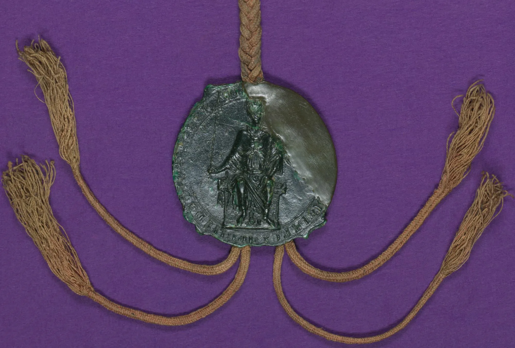 King's portrait on a seal from the Magna Carta with 4 tassels on a purple background