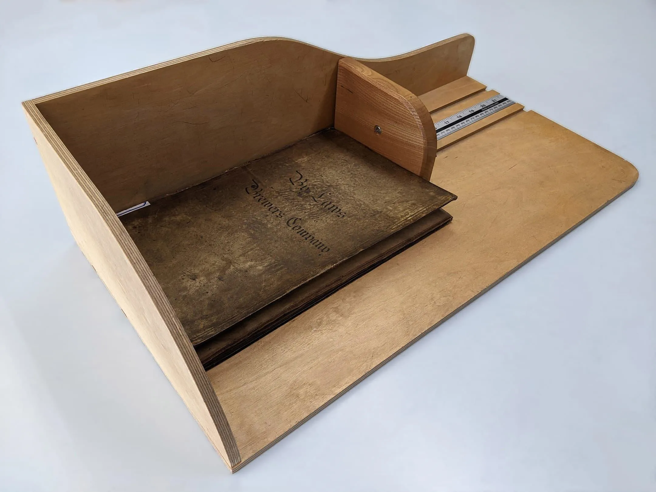 Measuring device with a book being measured
