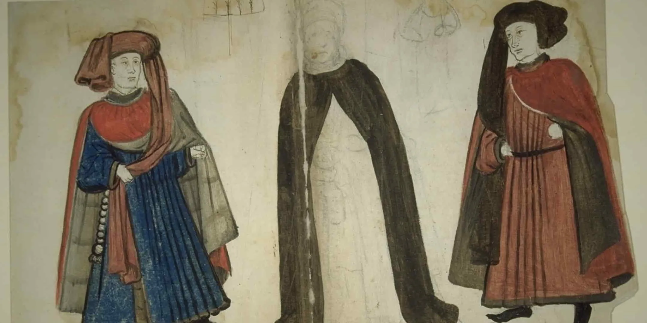 Two men standing either side of a woman, wearing medieval dress
