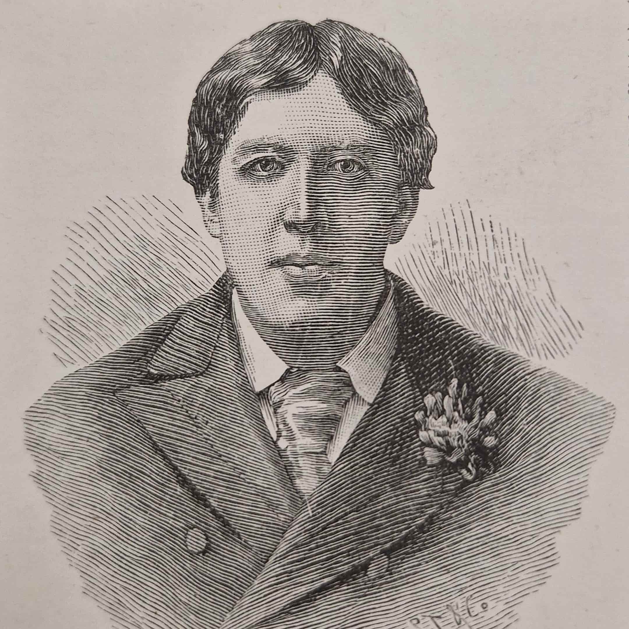 Man wearing a suit with wide tie and a flower in the lapel