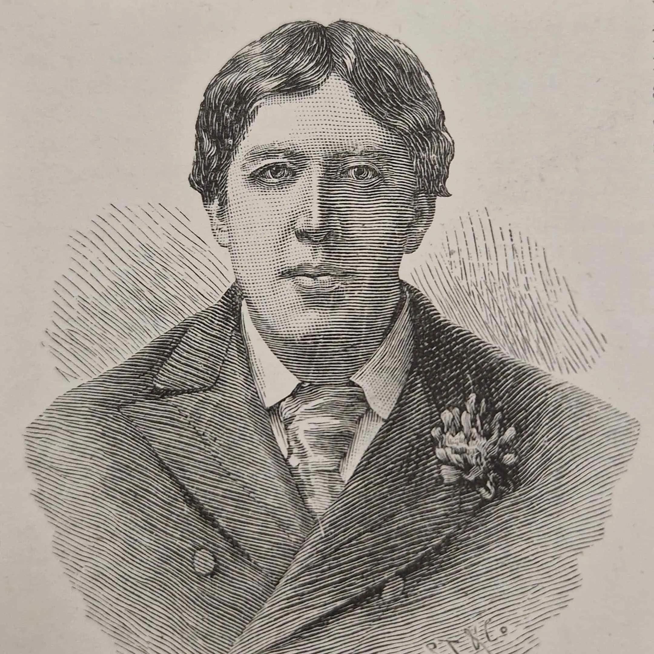 Man wearing a suit with wide tie and a flower in the lapel