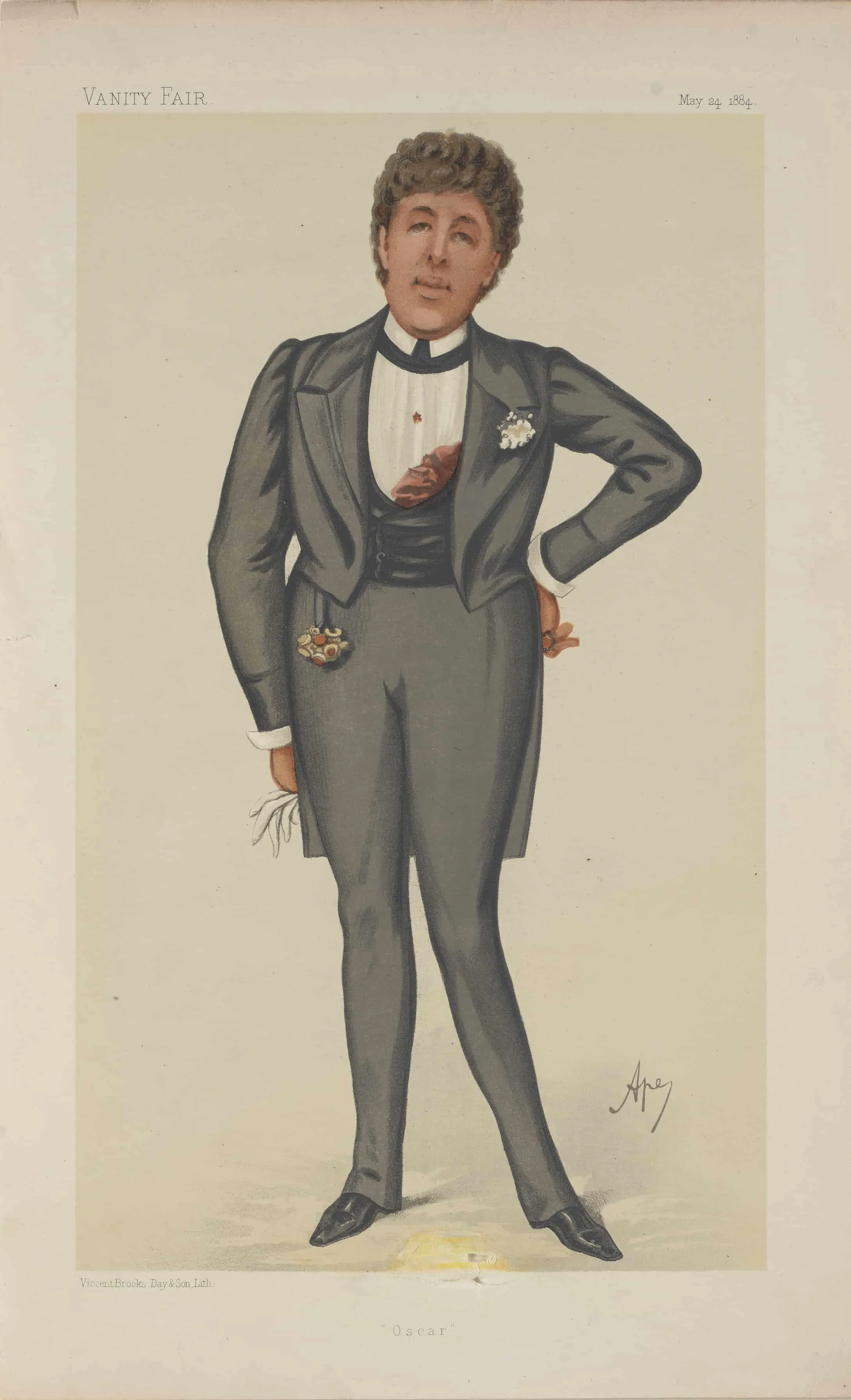 Man wearing a grey suit, flower brooch on left side of his chest.