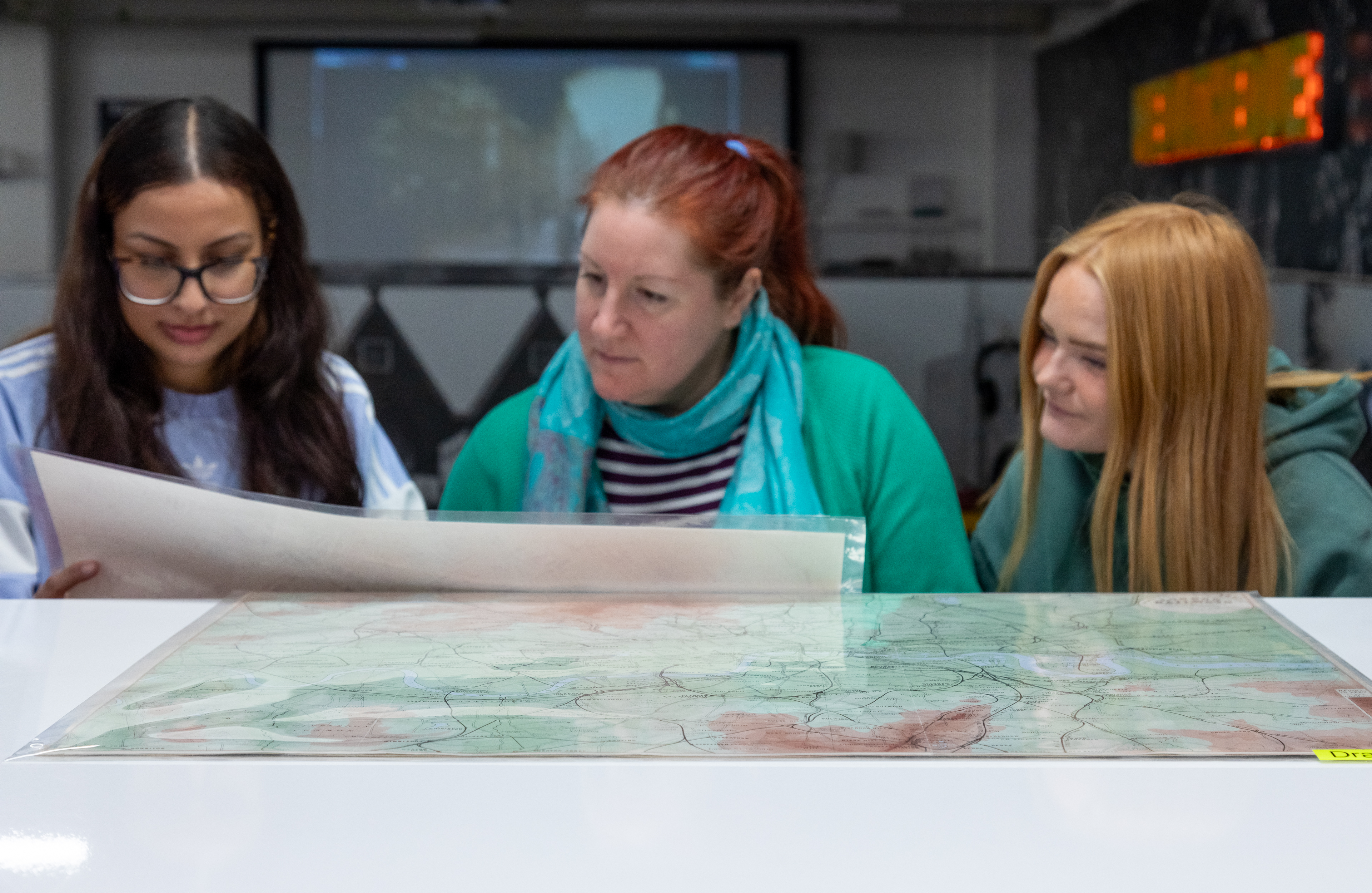 people-looking-at-a-map