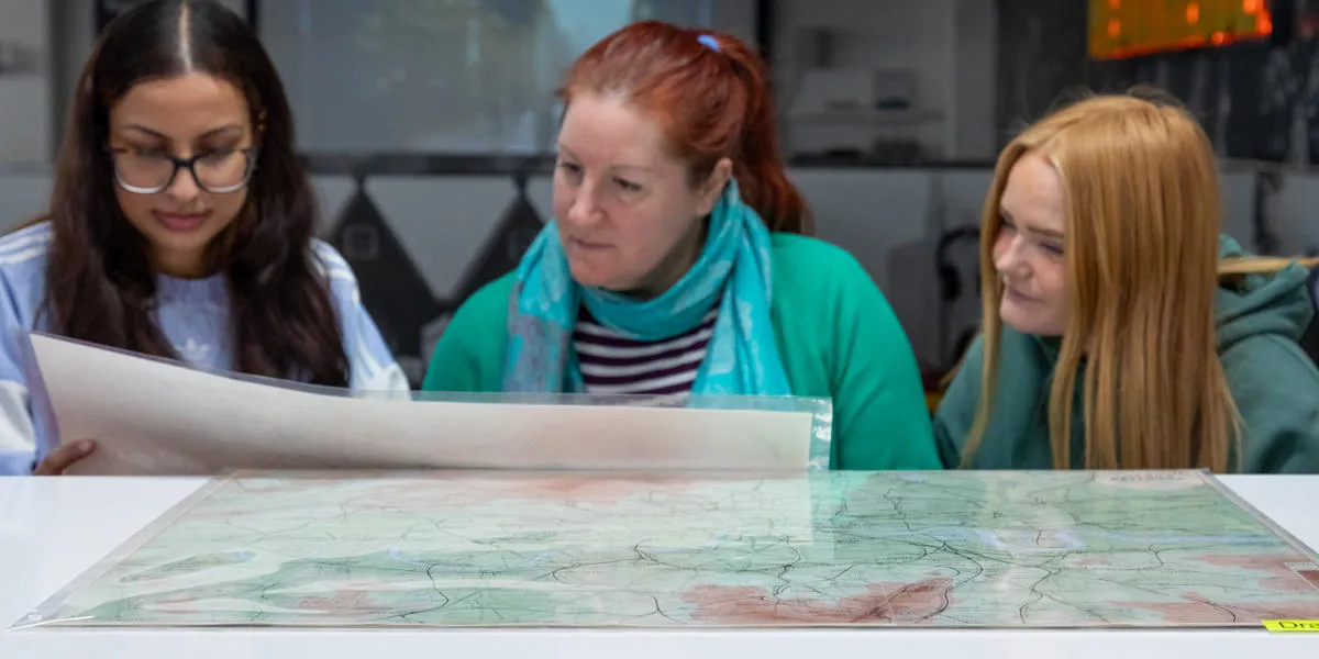 people-looking-at-a-map