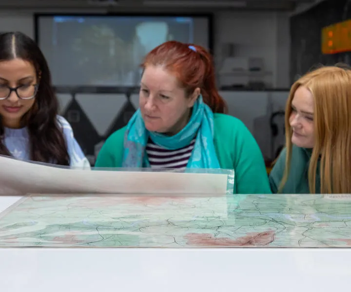 people-looking-at-a-map