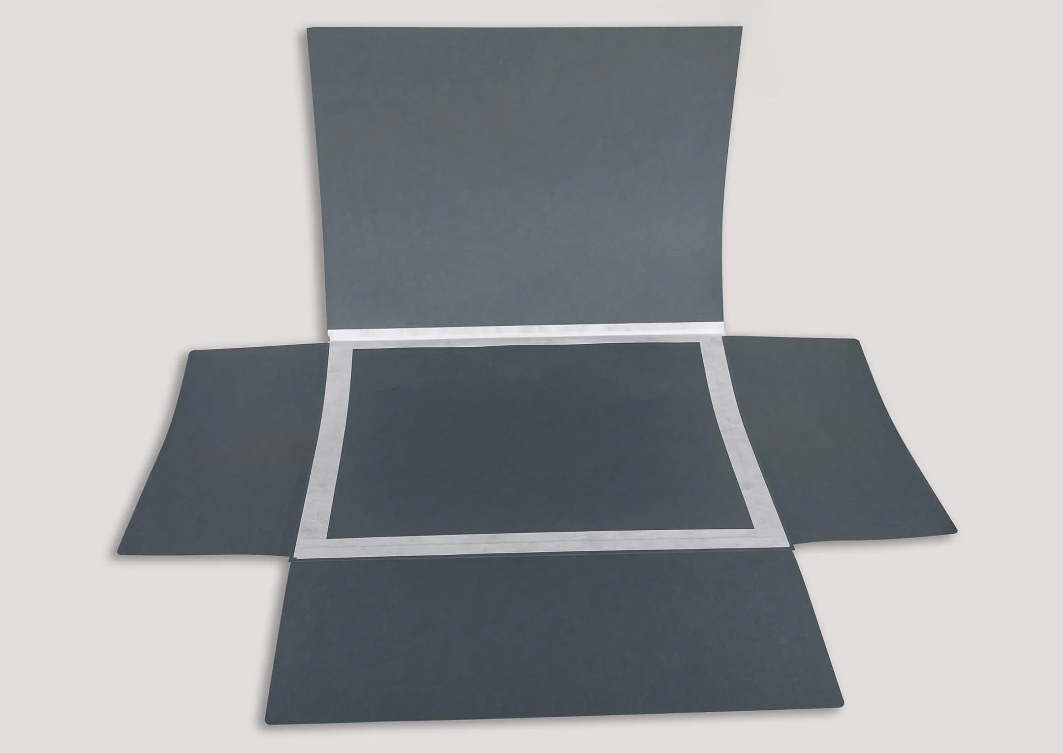 A plan folder with all flaps open, with Tyvek tape on the hinge and across the base of all flaps