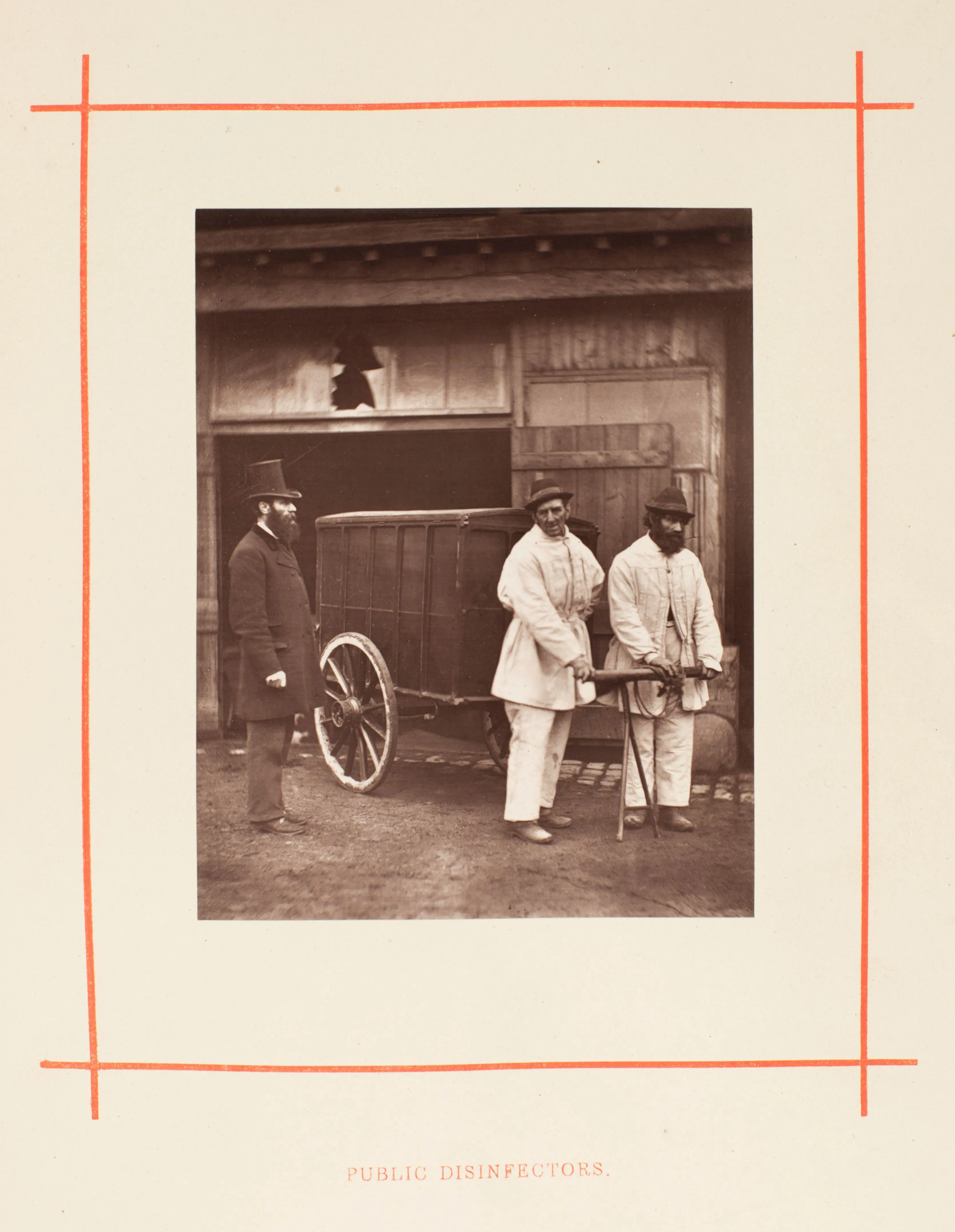 Two men in white pull a cart with a man in a top hat standing by