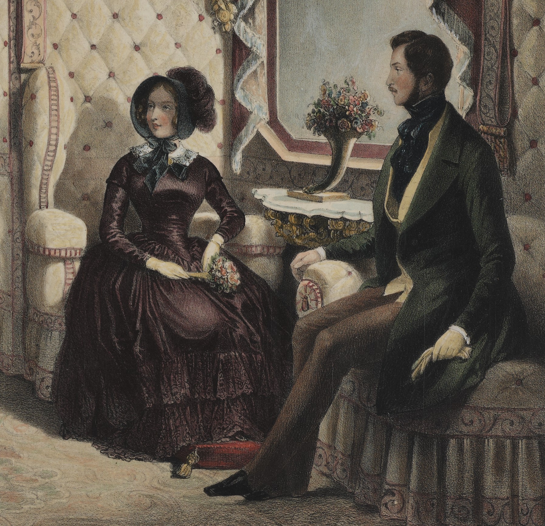 a padded seat with two people seated in luxurious surroundings