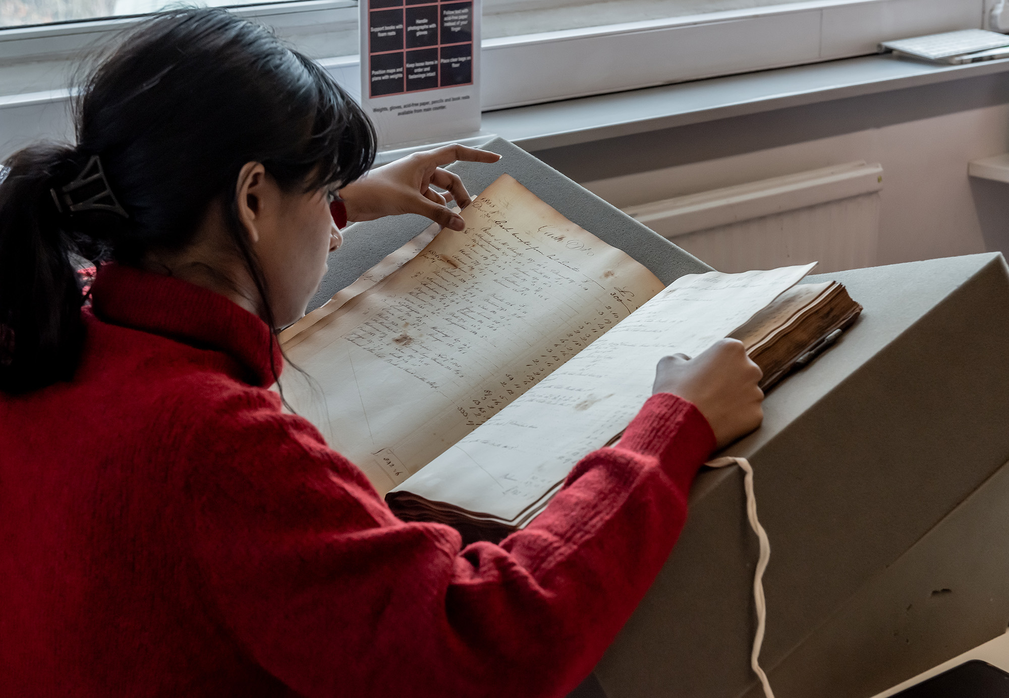 researcher-looking-at-large-archive-in-asa