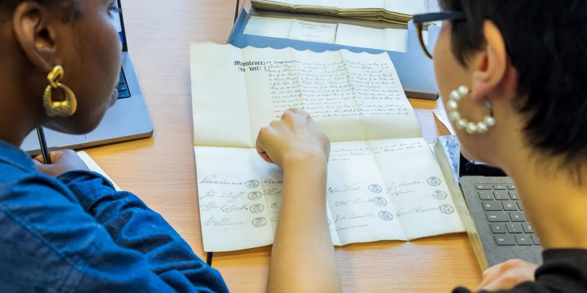 researchers-looking-at-document
