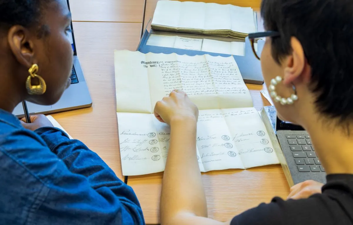 researchers-looking-at-document