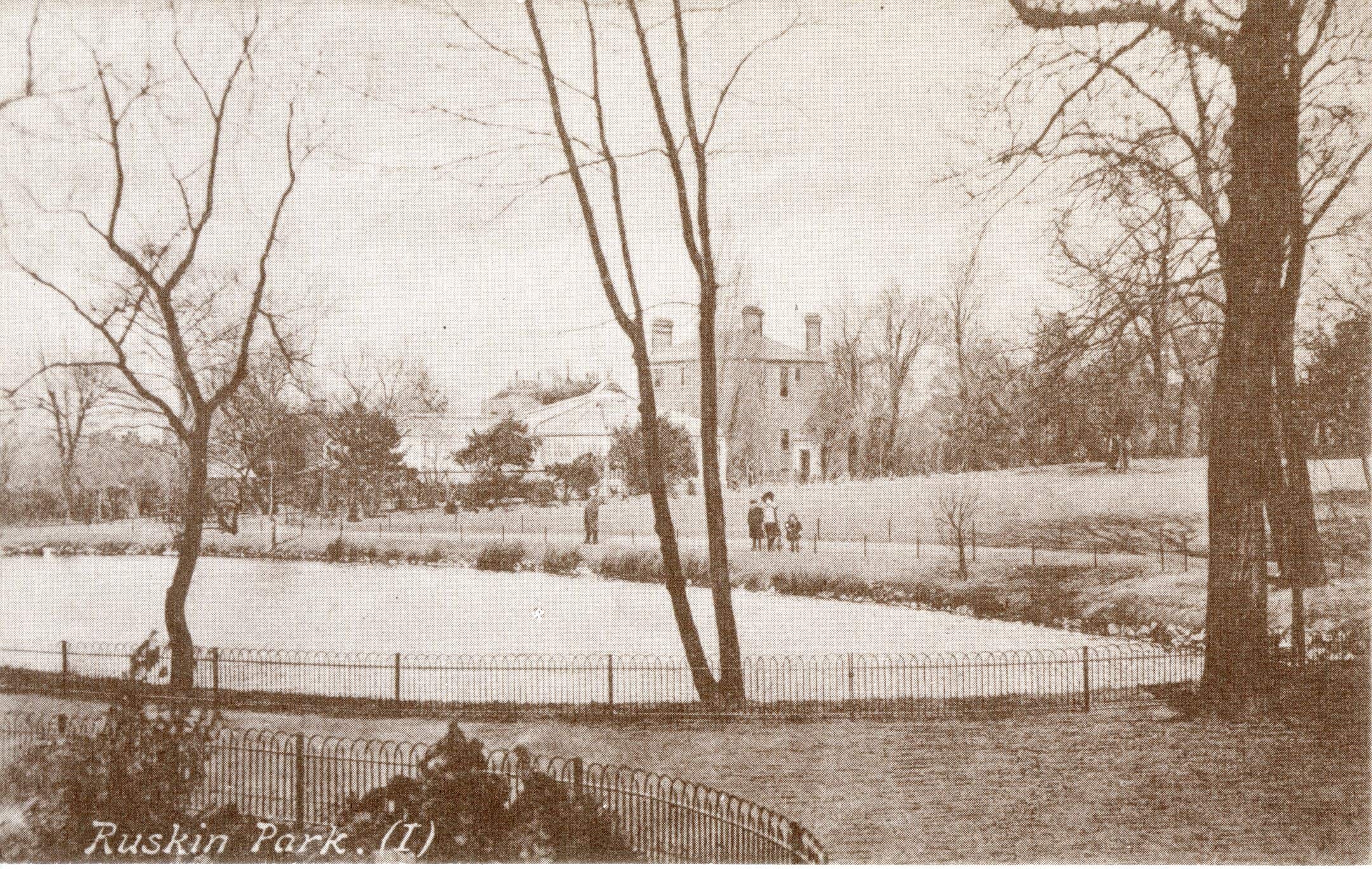 View of Ruskin Park, Camberwell with children walking around the lake, 1900 