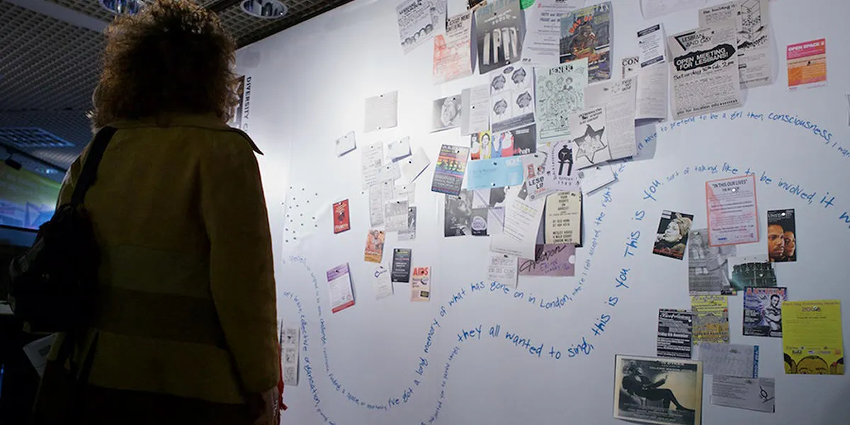 Visitor looking at a wall display from the Speak Out london - Diversity City exhibition