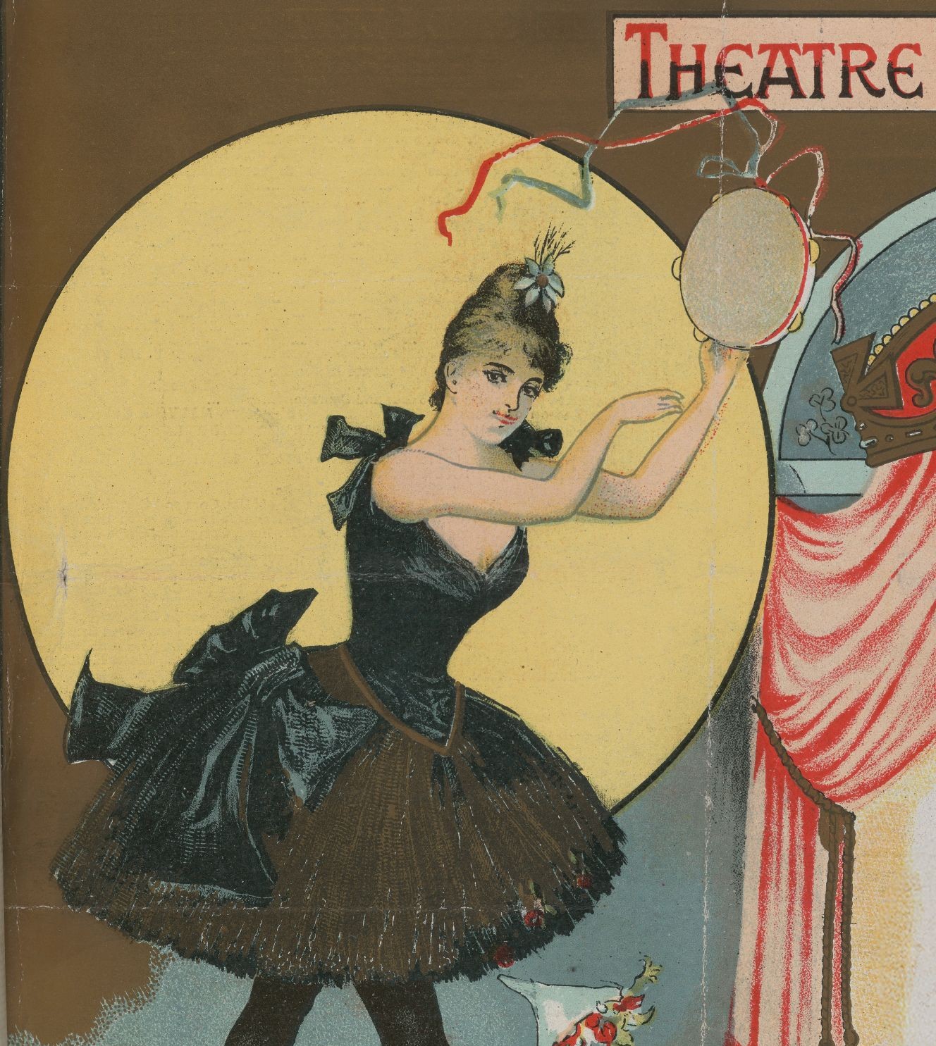 A woman in a tutu holding a tambourine on a theatre stage