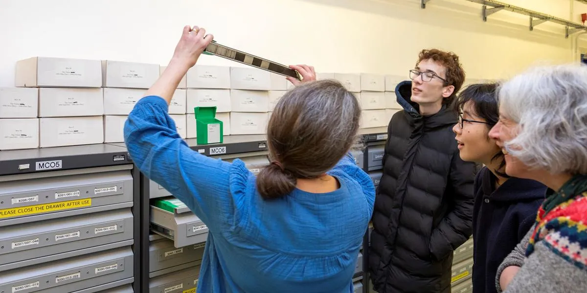 staff-showing-film-roll-at-huntley-conference