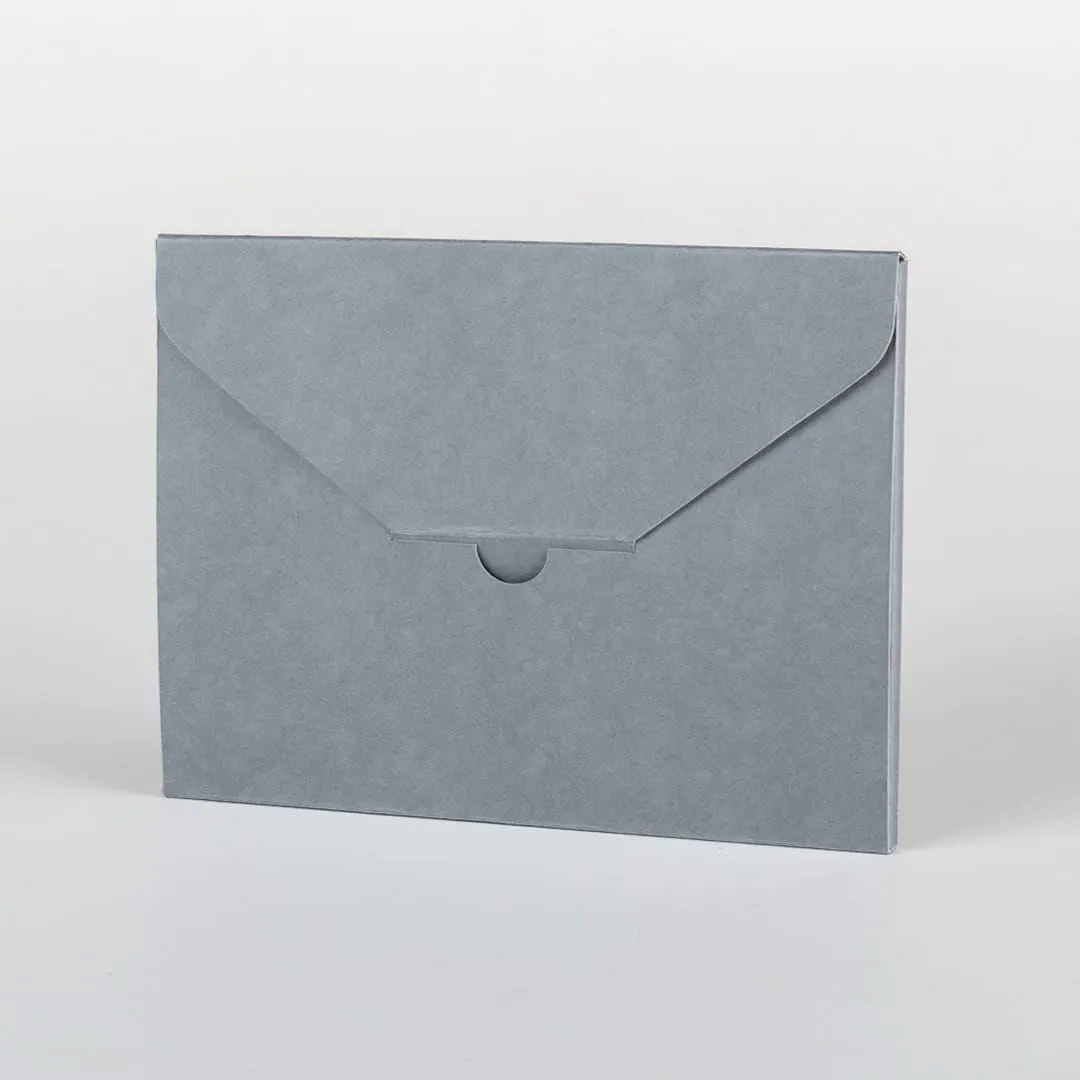 Closed tabbed folder, showing locking flap halfway across the width