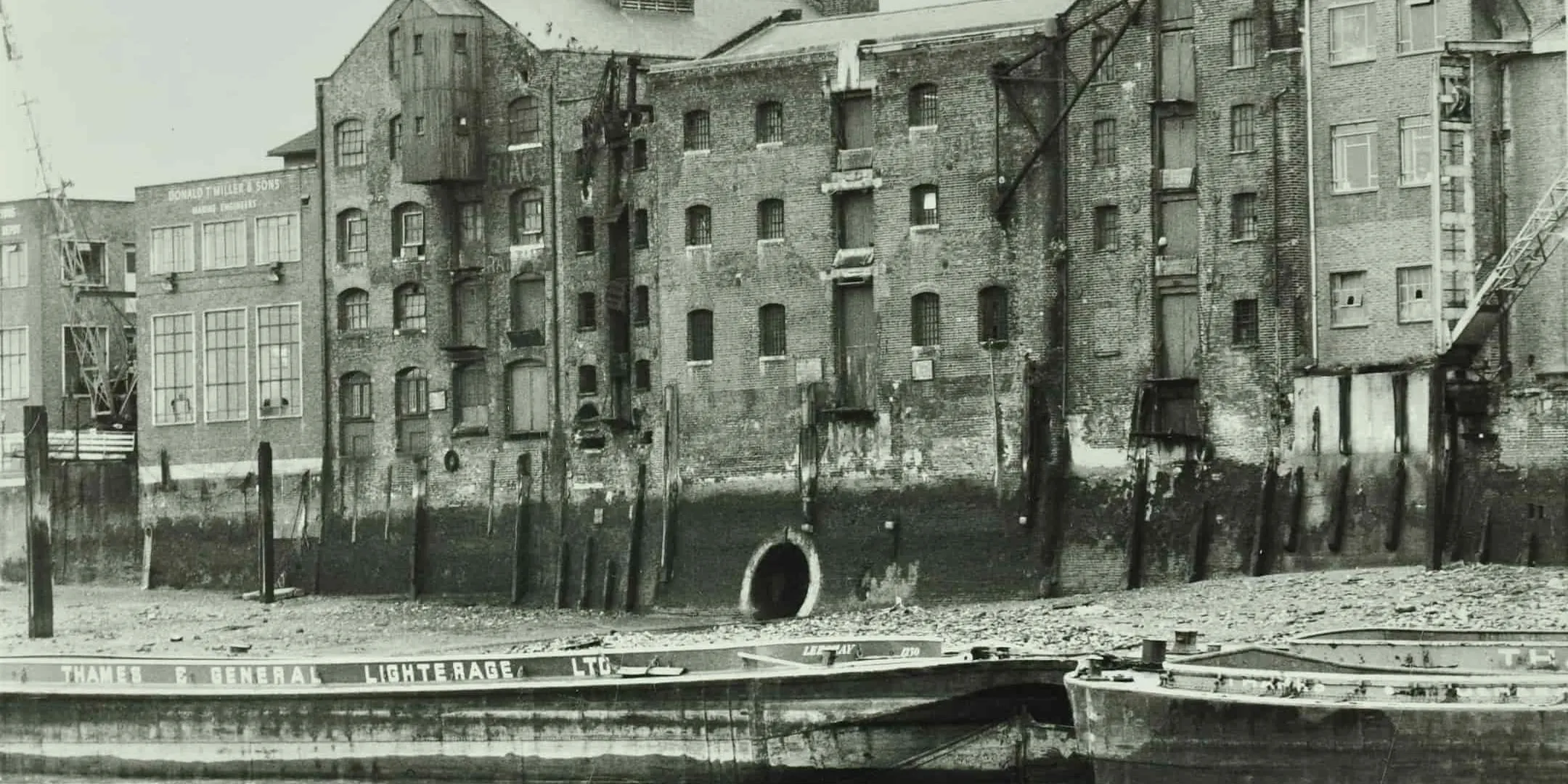 Boats on the river, in front of buildings