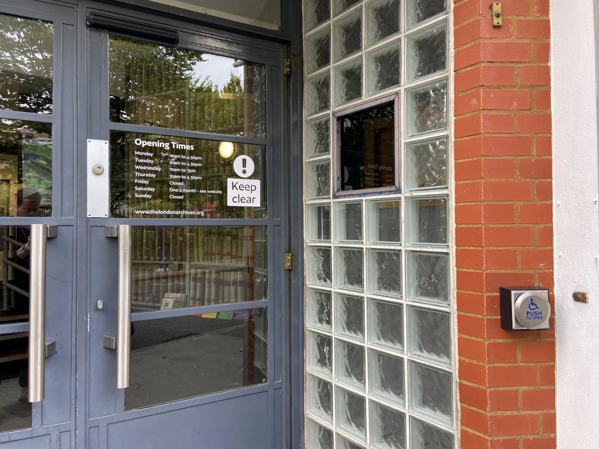 Entrance door with push button opening at The London Archives.