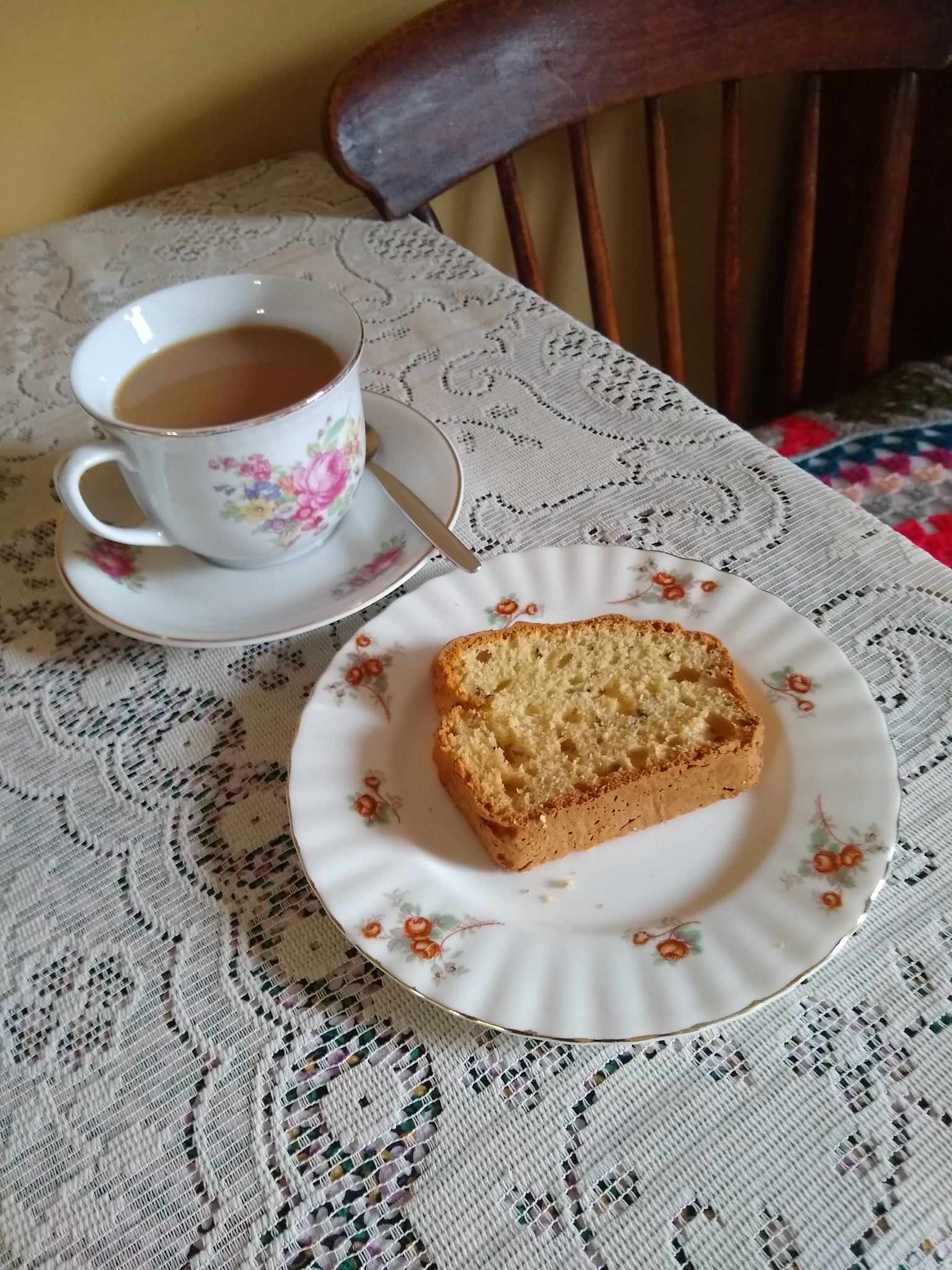 Seed Cake on a plate with a cup of tea