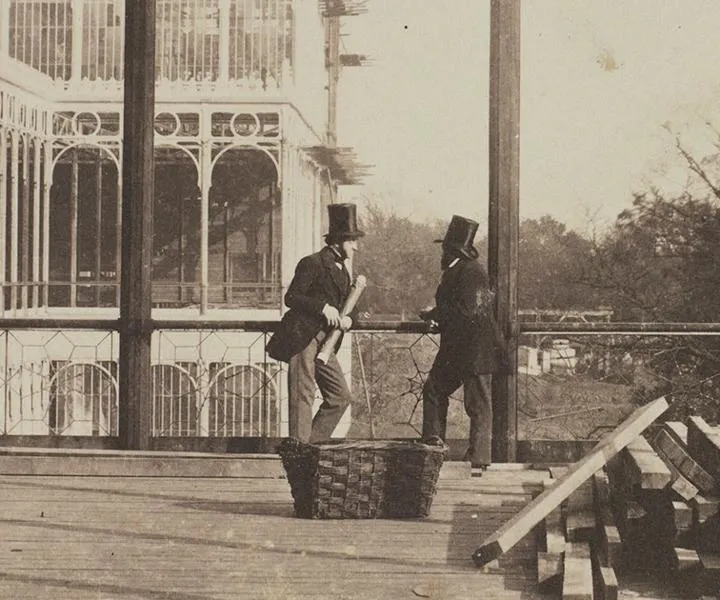 Victorian architects consult rolled plans at the reconstruction of the Crystal Palace in 1852