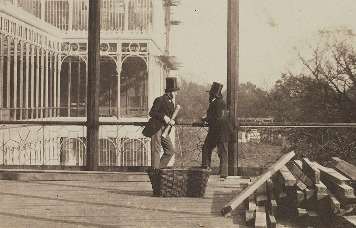 Victorian architects consult rolled plans at the reconstruction of the Crystal Palace in 1852