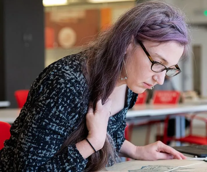 visitor-looking-at-archive-map