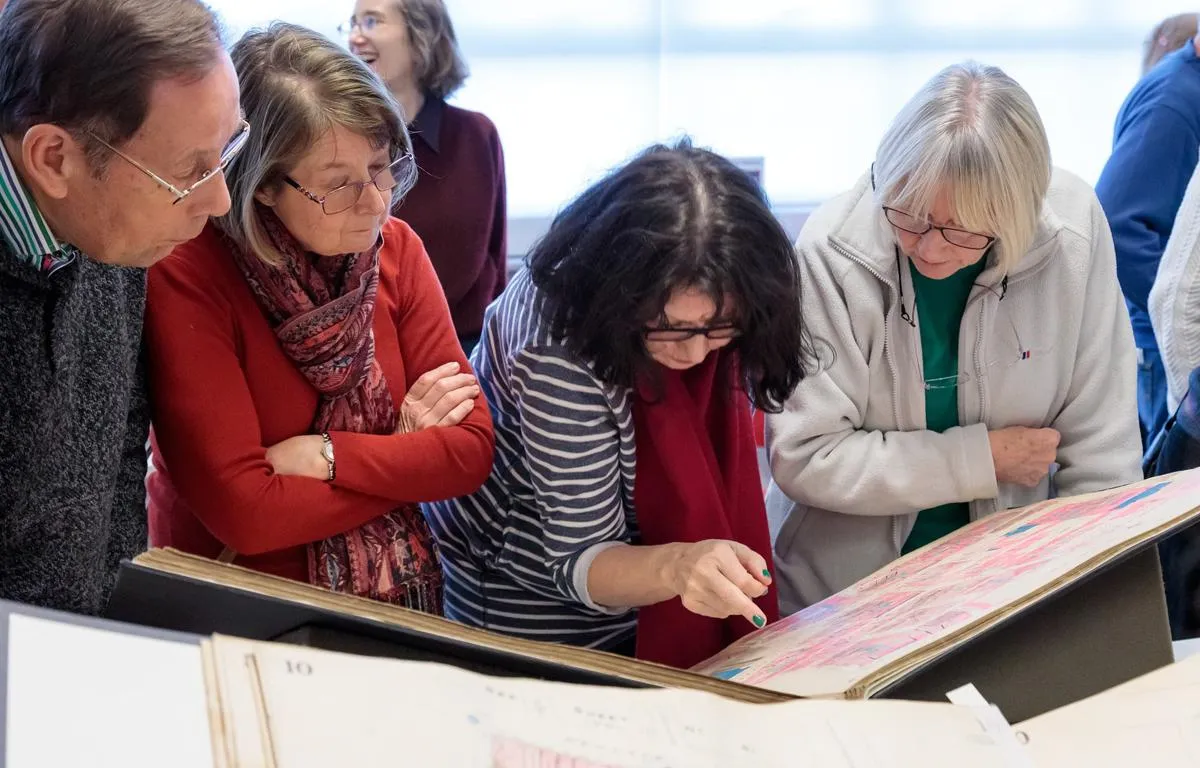 visitors-looking-at-an-archive-document